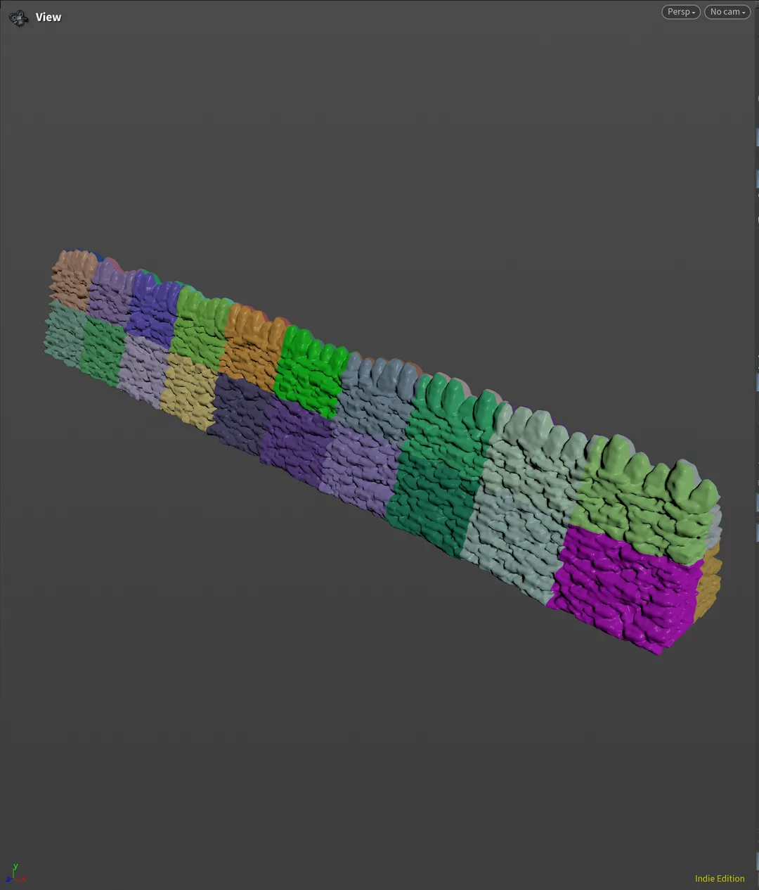 Houdini viewport showing a dry-stone wall divided into coloured connectivity groups.